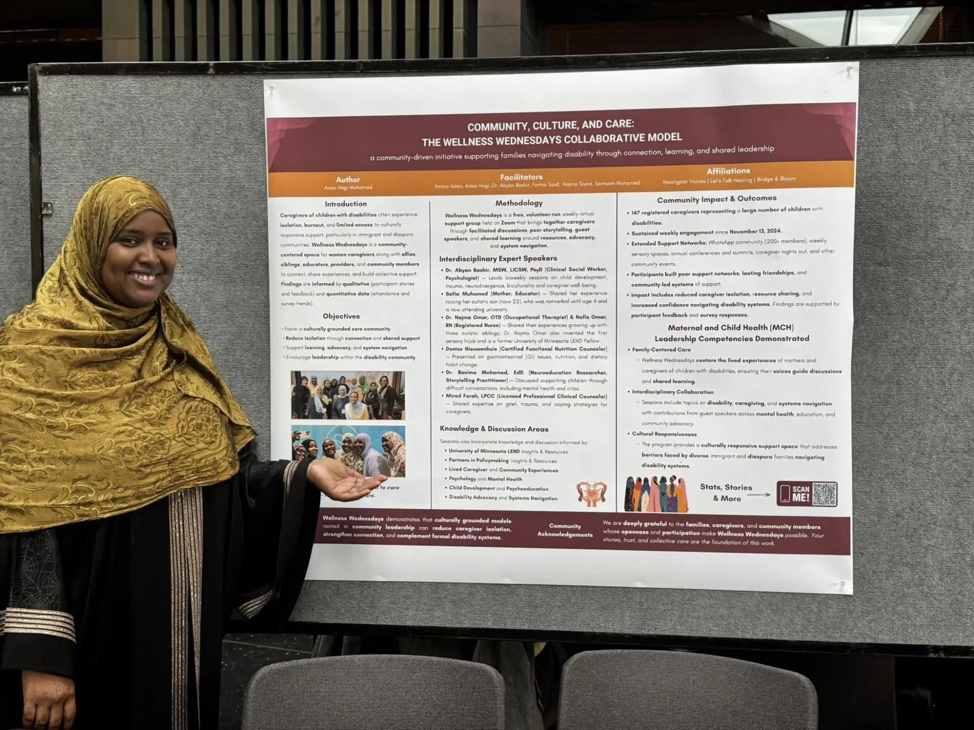 Anisa Hagi-Mohamed, in a gold hijab, presents the Wellness Wednesdays research poster at the University of Minnesota.