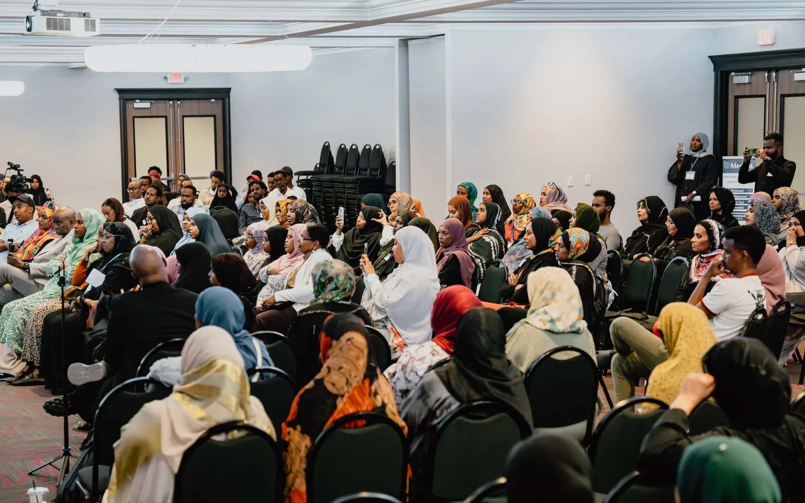 A full room of families and community members listens during Maangaar Summit 2025.